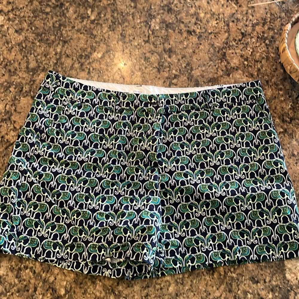 Elephant print shorts in classic blue and green .